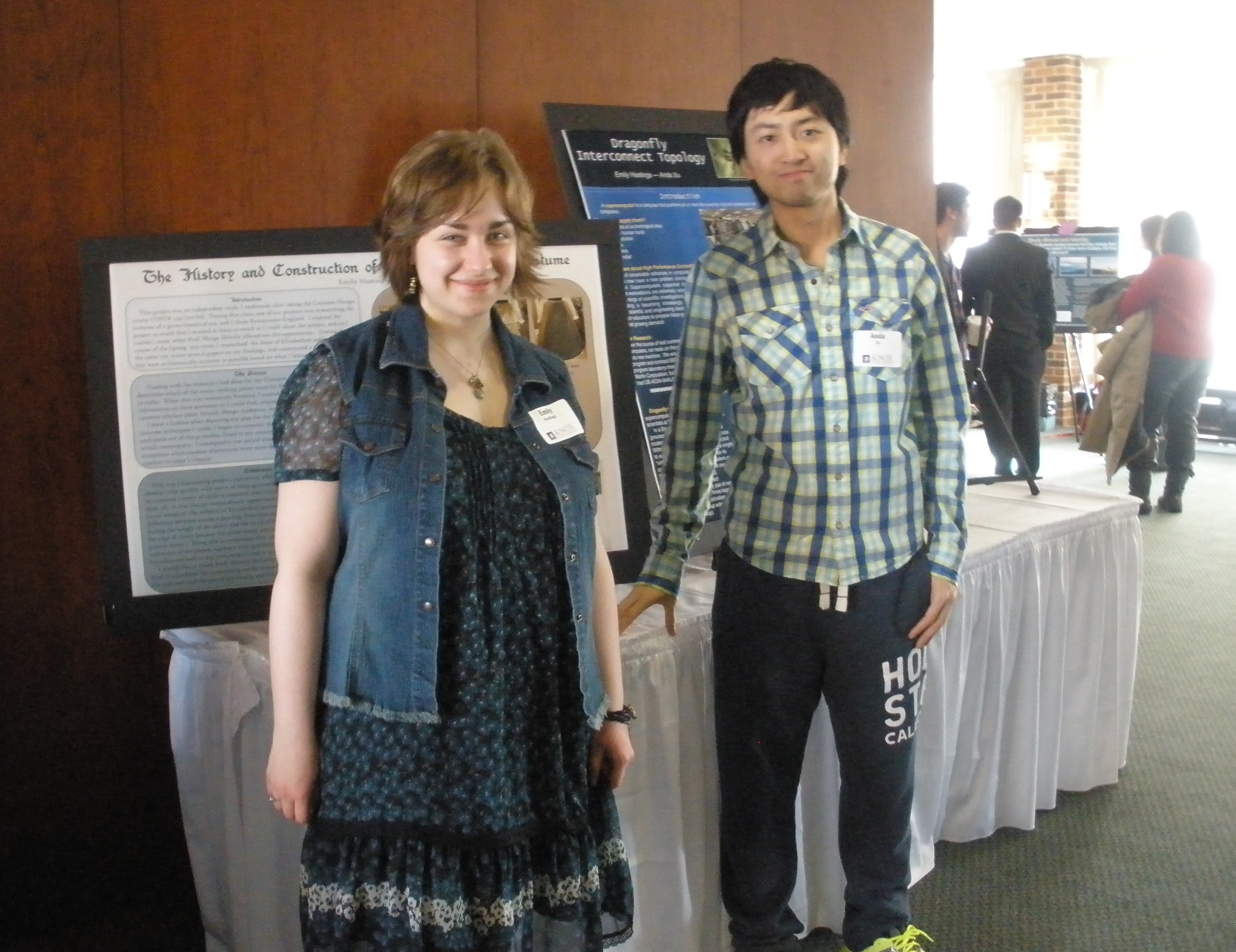 Emily and Anda stand by their poster.