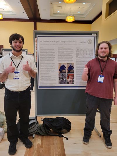 Ethan and Hunter presenting their CERCA poster